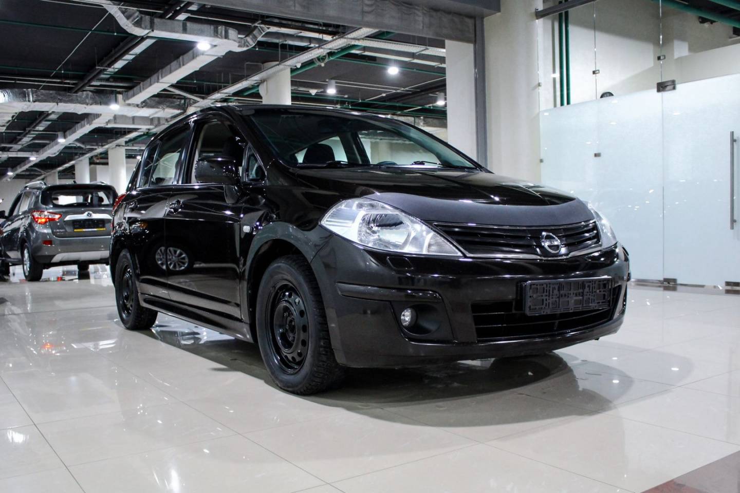 Купить Tiida с пробегом